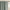 Close-up of a sage green rod pocket curtain panel with a gathered top, hanging on a golden decorative rod.