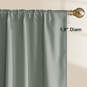 Close-up of a sage green rod pocket curtain panel with a gathered top, hanging on a golden decorative rod.