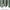 Draped sage green blackout curtain fabric, showing its smooth texture and neatly stitched bottom hem detail.