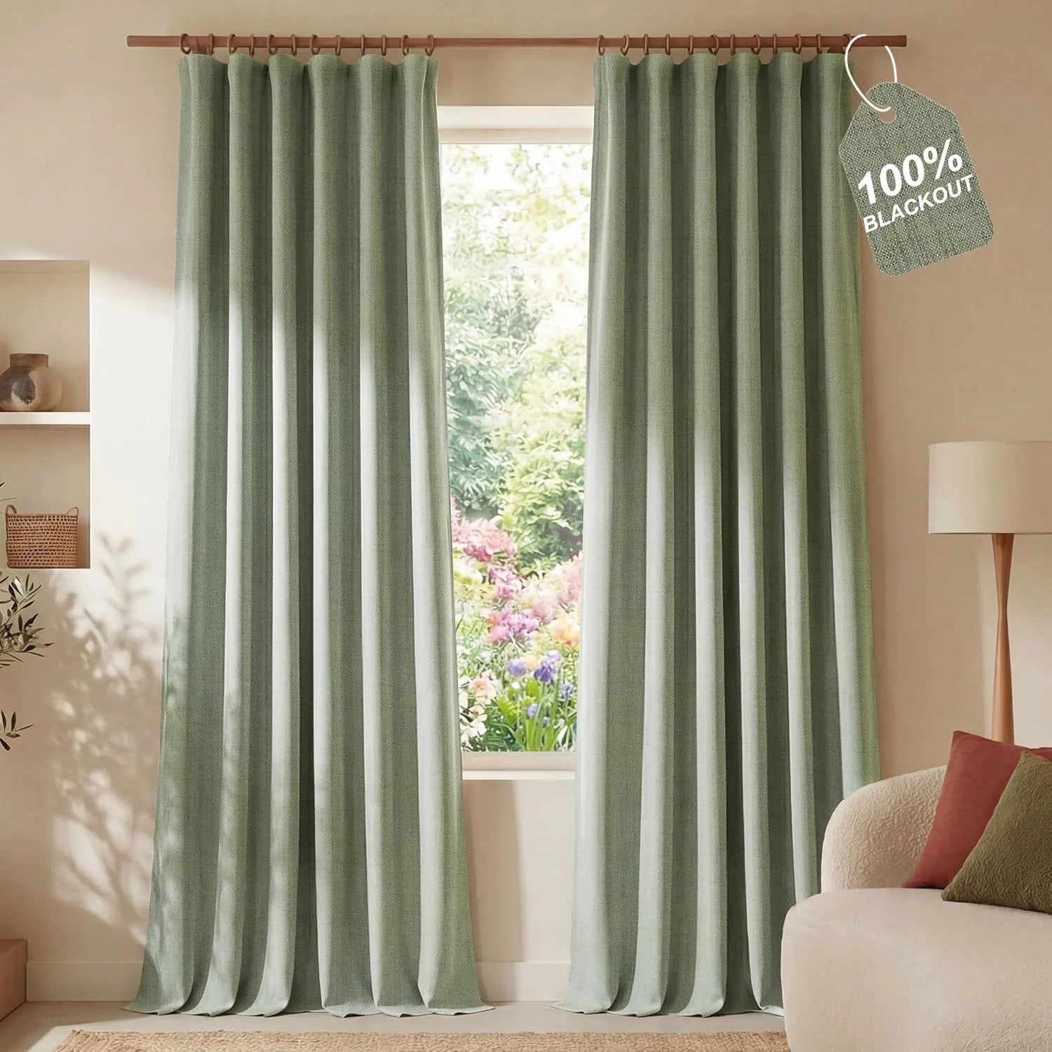 Sage green textured blackout curtains on wooden rod in bright living room, garden view.