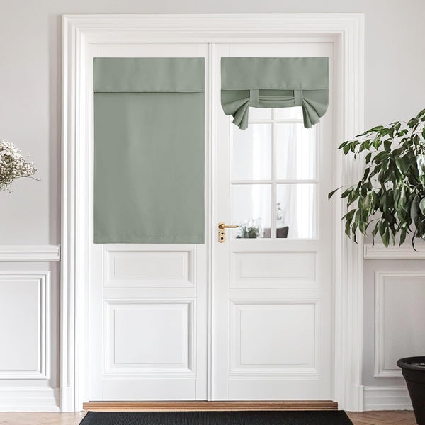 Two sage green window shades, one flat panel and one tie-up style, on a white French door.