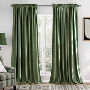 Plush sage green velvet window curtains with a gathered top beautifully framing a white window.