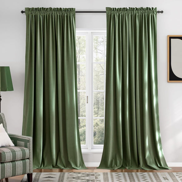 Plush sage green velvet window curtains with a gathered top beautifully framing a white window.