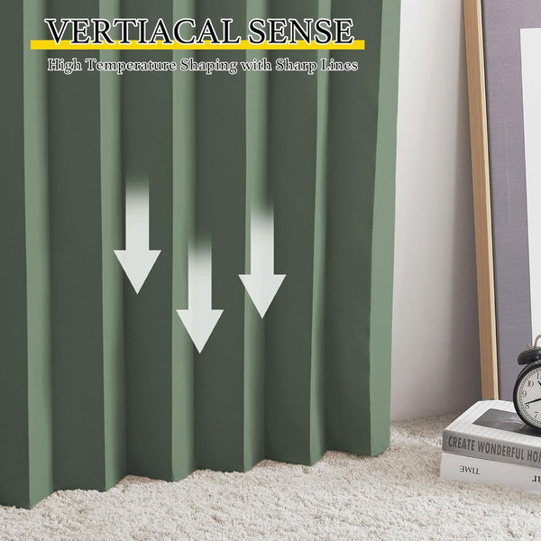 Sage green vertical pleated blind with sharp, structured folds, hanging over a shaggy white carpet.