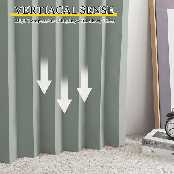 Close-up of sage green drapes featuring sharp, structured vertical pleats, touching a cream shag rug.