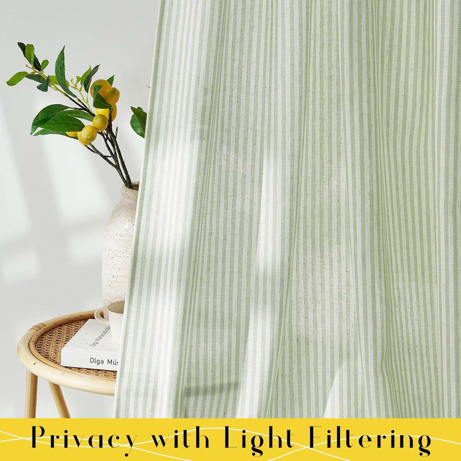 Sage green and white vertical striped light filtering curtain with a textured fabric.
