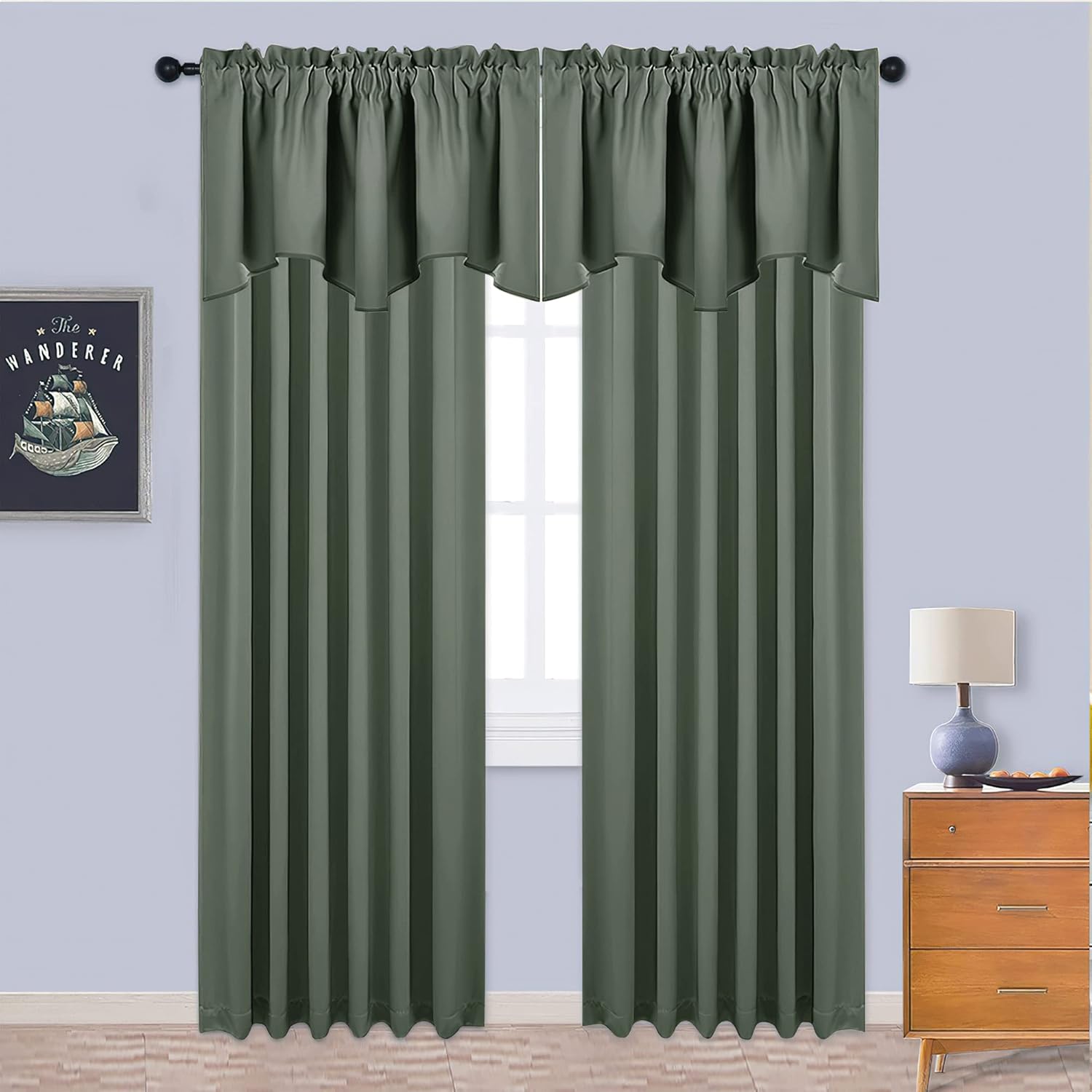 Sage green solid curtain panels with a rod pocket top and integrated scalloped valance, hung on a black rod.