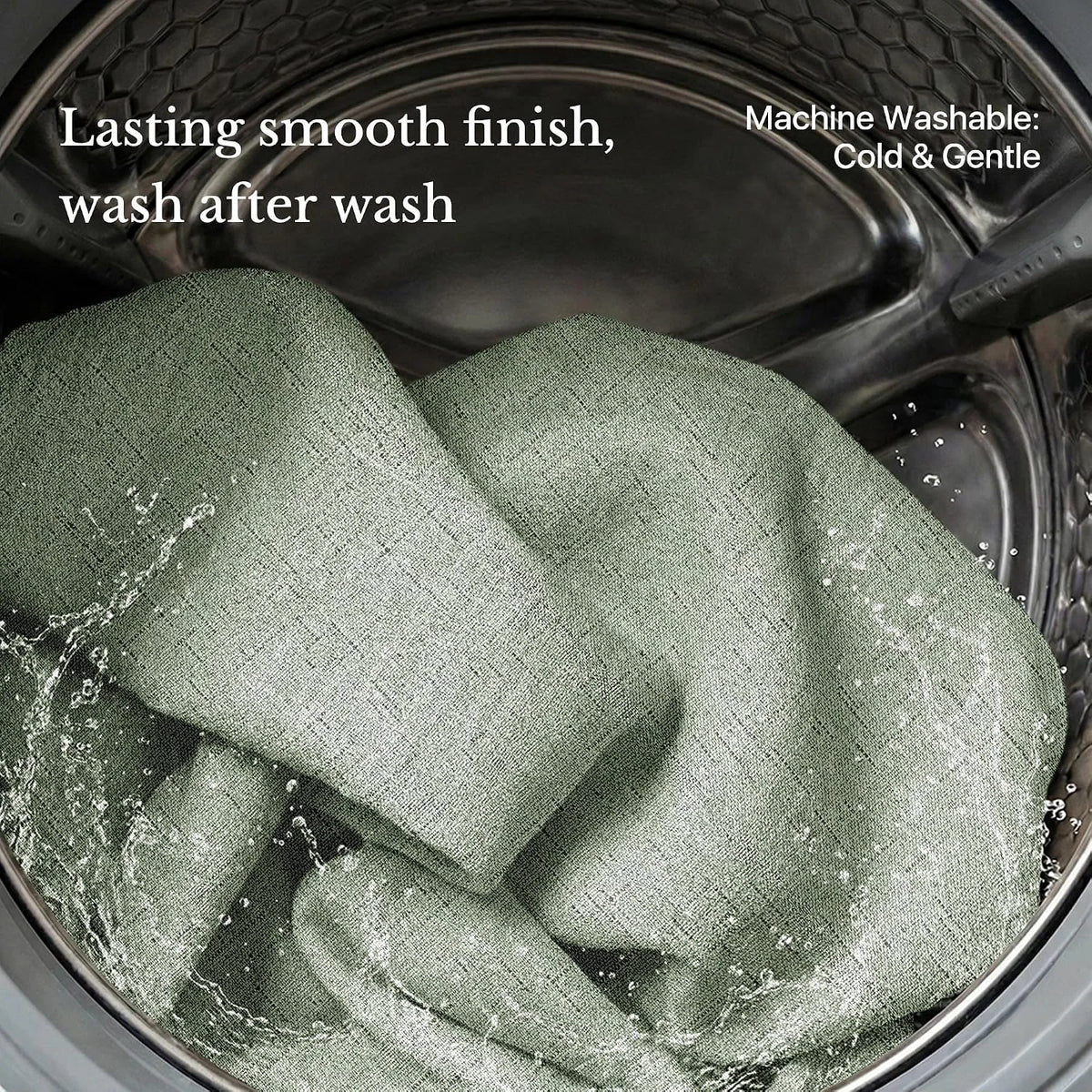 Sage green linen-look curtain fabric inside a washing machine drum with water
