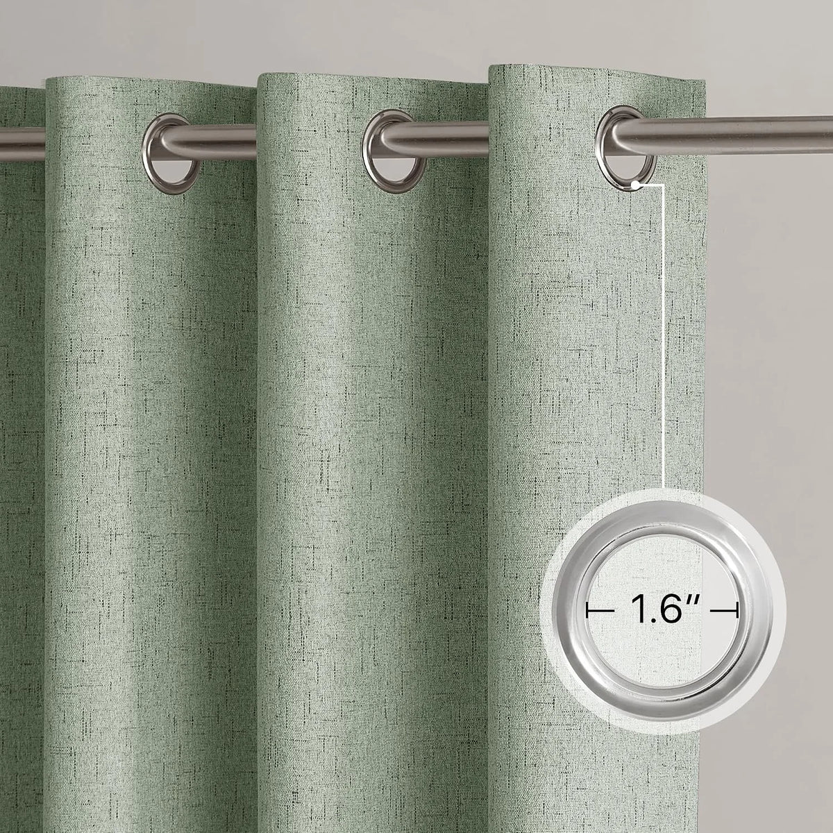 Sage green textured curtain panel with silver metal grommets on a curtain rod