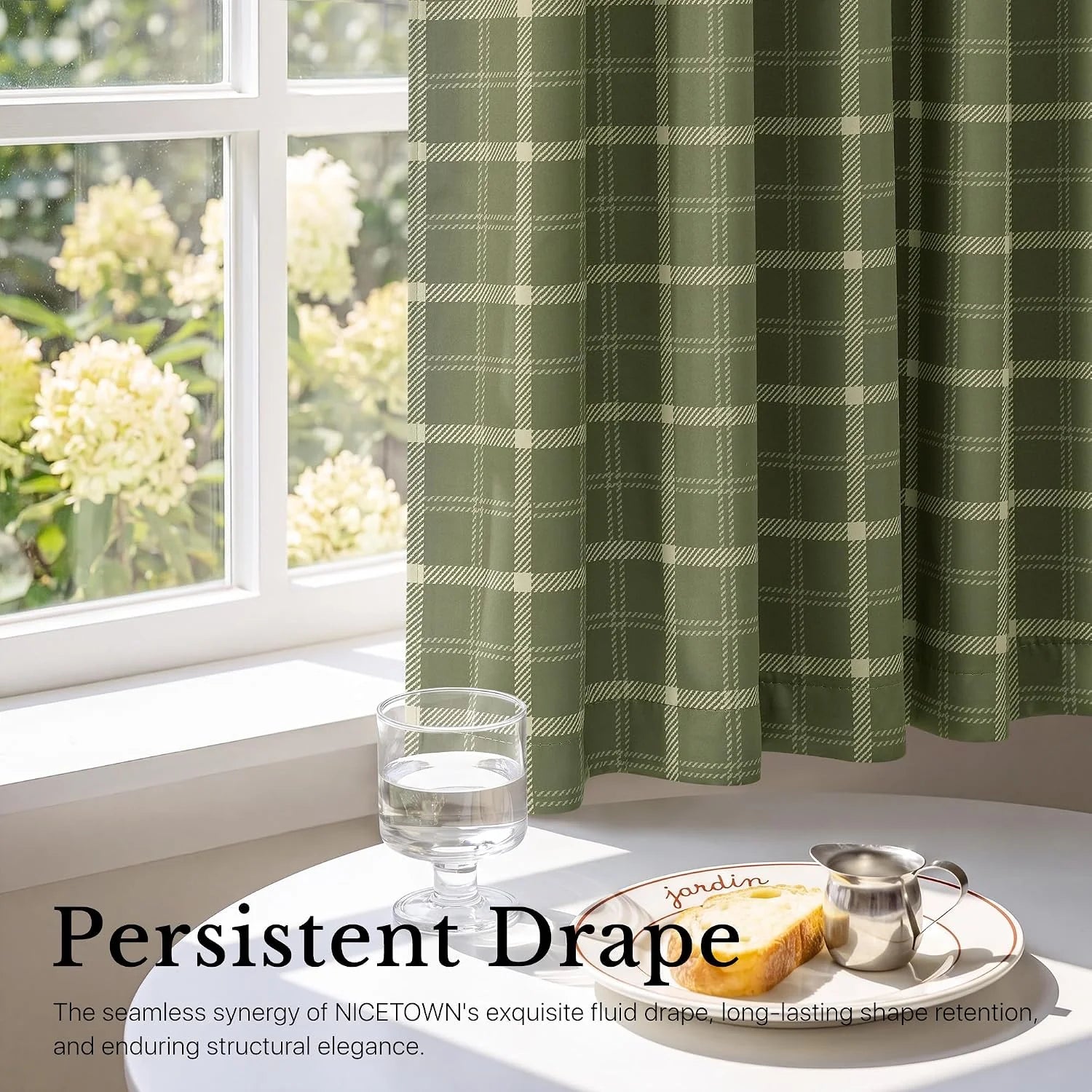 Sage green plaid cafe curtain draped beside a bright window over a breakfast table