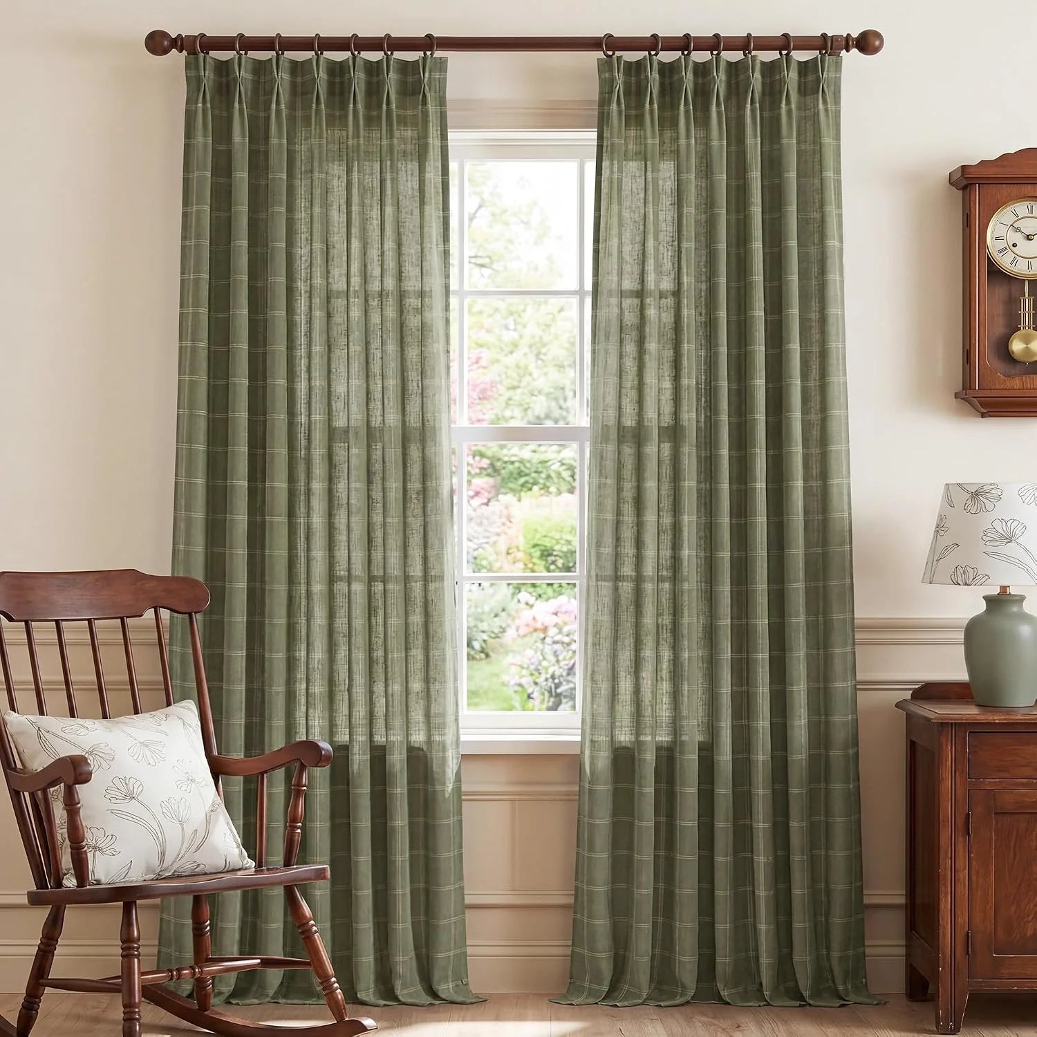 Sage green plaid sheer curtains on rings in a cozy traditional room