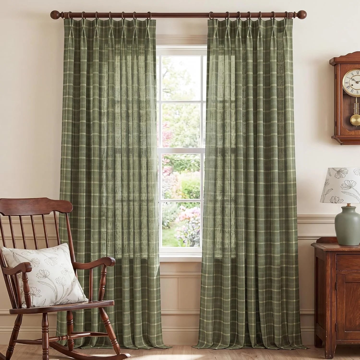 Sage green plaid sheer curtains hanging on a wood rod in a traditional room