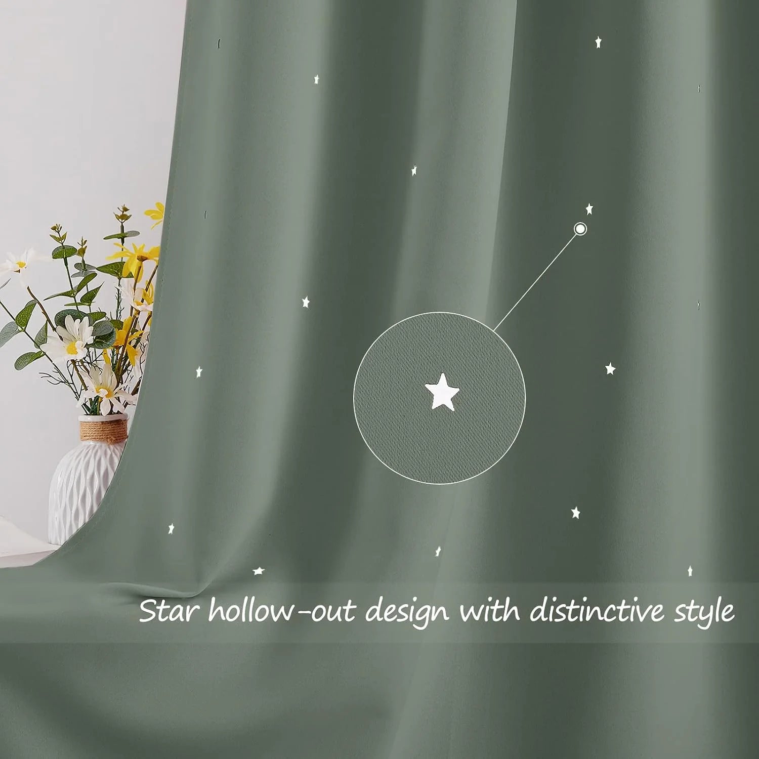 Sage green curtain with tiny star cutout pattern draped beside a white floral vase