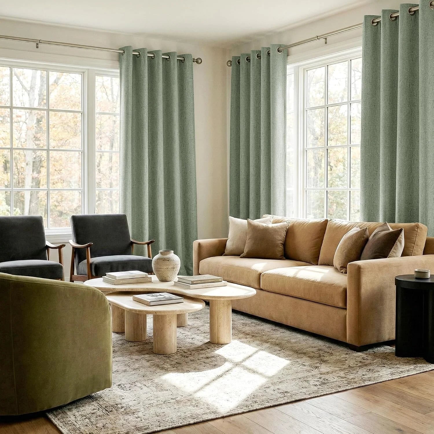 Sage green textured grommet curtains framing bright windows in a modern living room