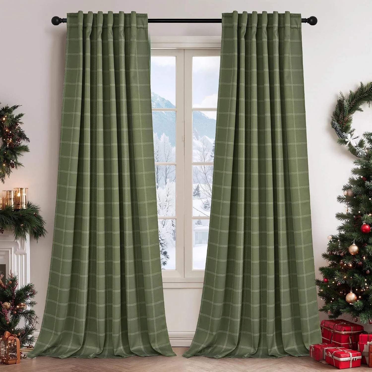 Sage green windowpane curtains on a black rod in a festive living room window