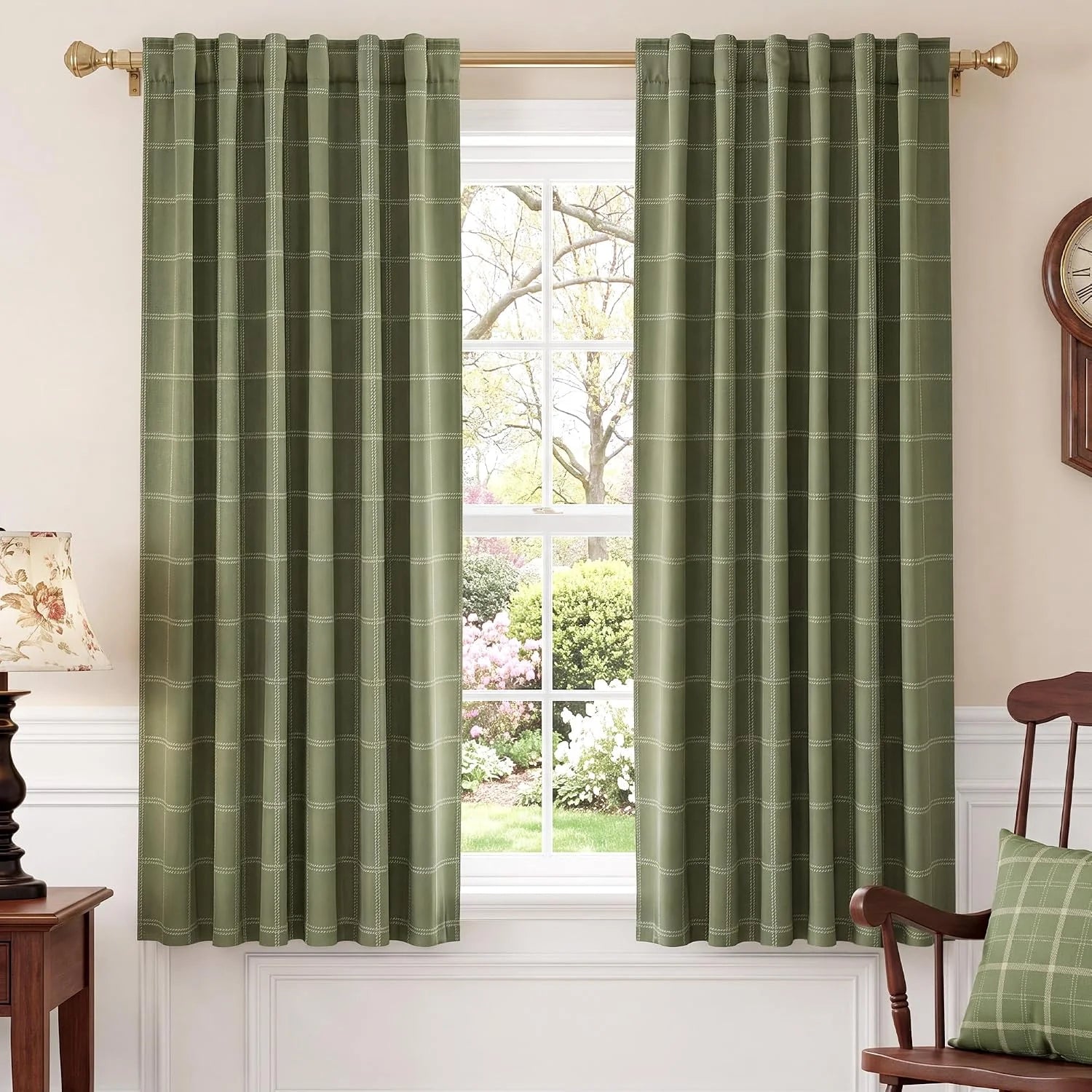Sage green windowpane curtains with rod pocket top hanging in a traditional room