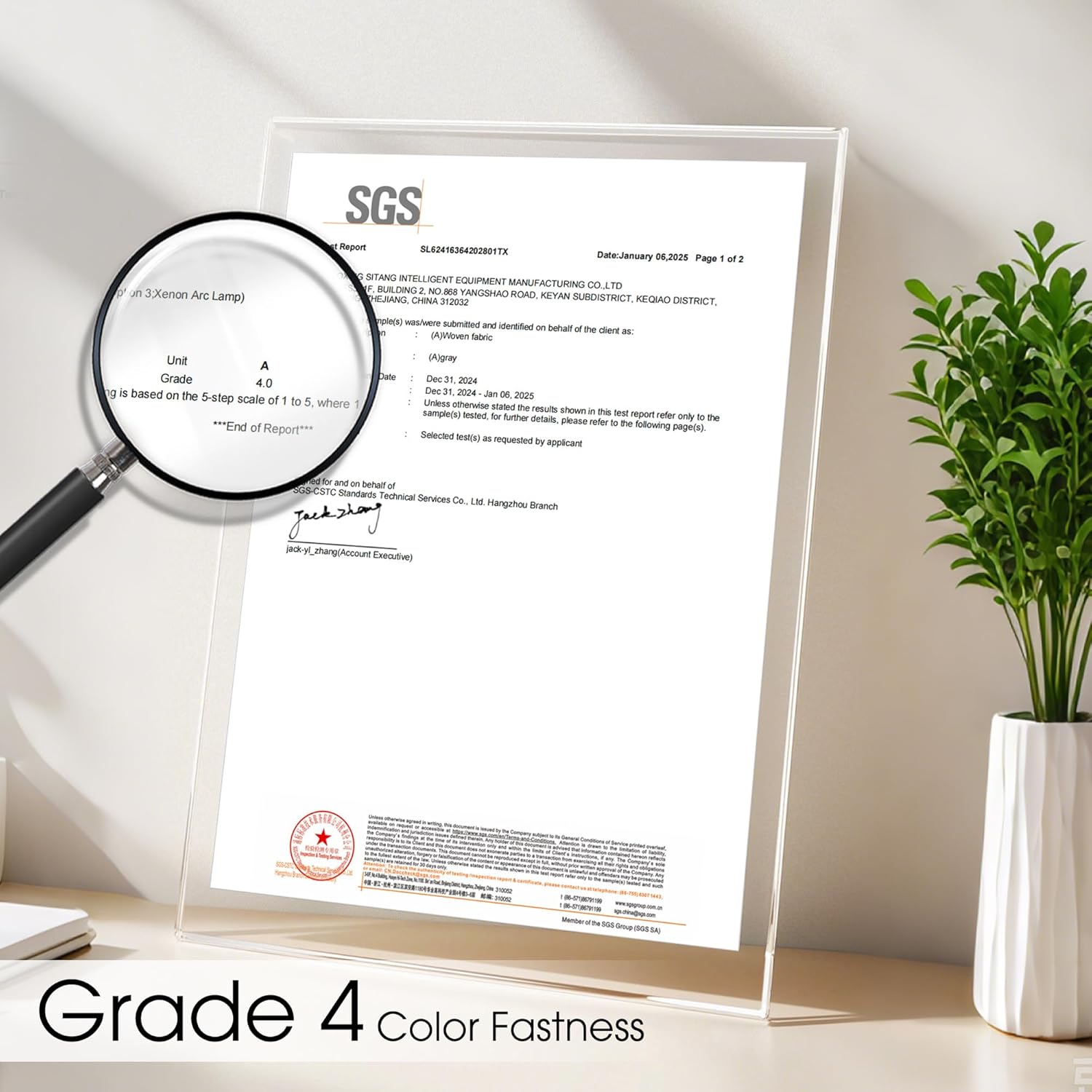 Official SGS test report in a clear acrylic stand, showing 'Grade 4 color fastness' detail magnified.