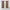 Pair of short mocha brown room darkening curtains with silver grommets hanging on a dark rod above a window.