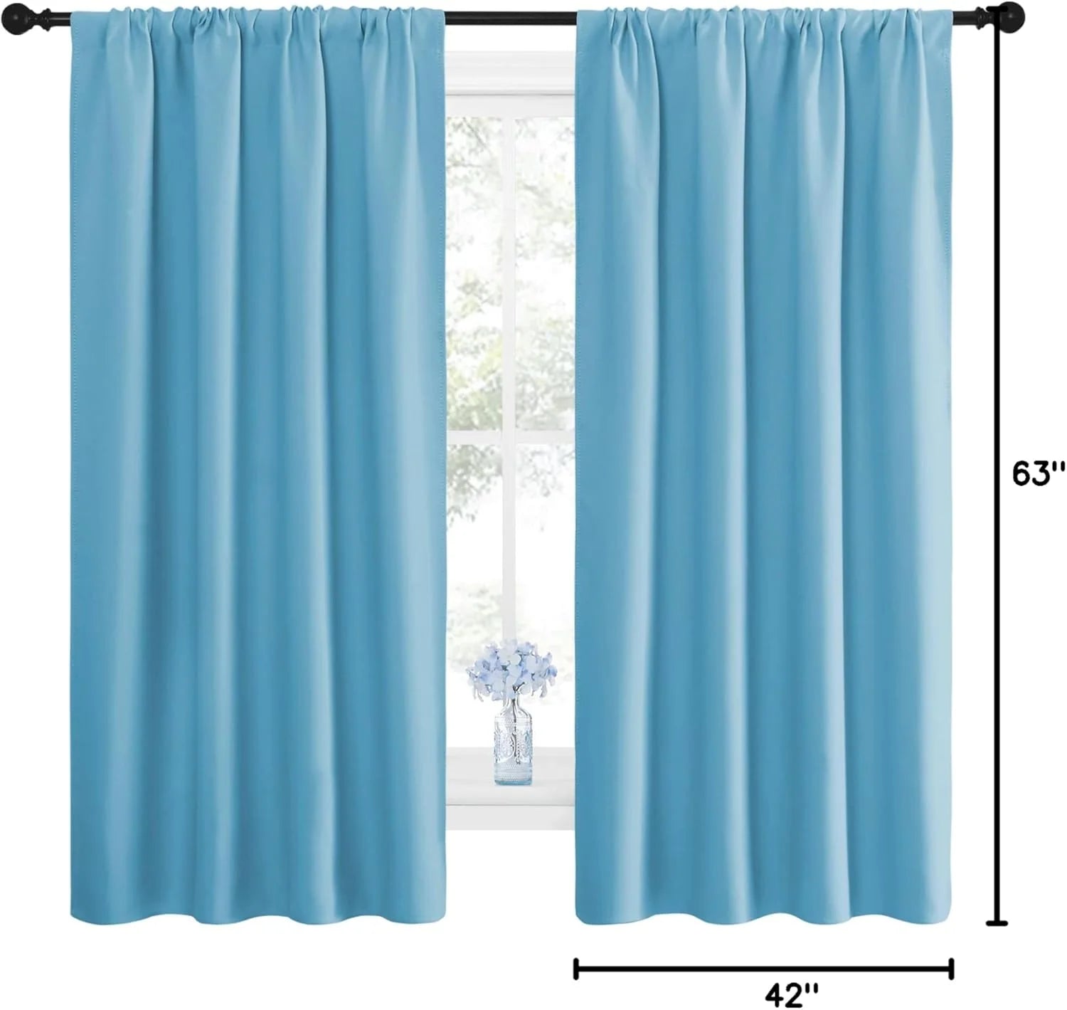 Sky blue rod pocket curtain panels hanging on a black curtain rod by a bright window