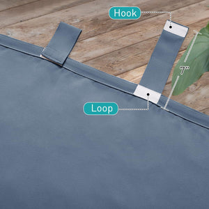 Close-up of a slate blue fabric curtain panel featuring a 7-inch hook and loop tab closure.