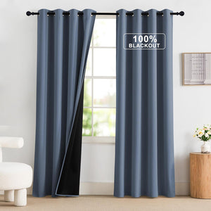 Slate blue curtains with grommet top, showing thick black lining for 100% blackout.