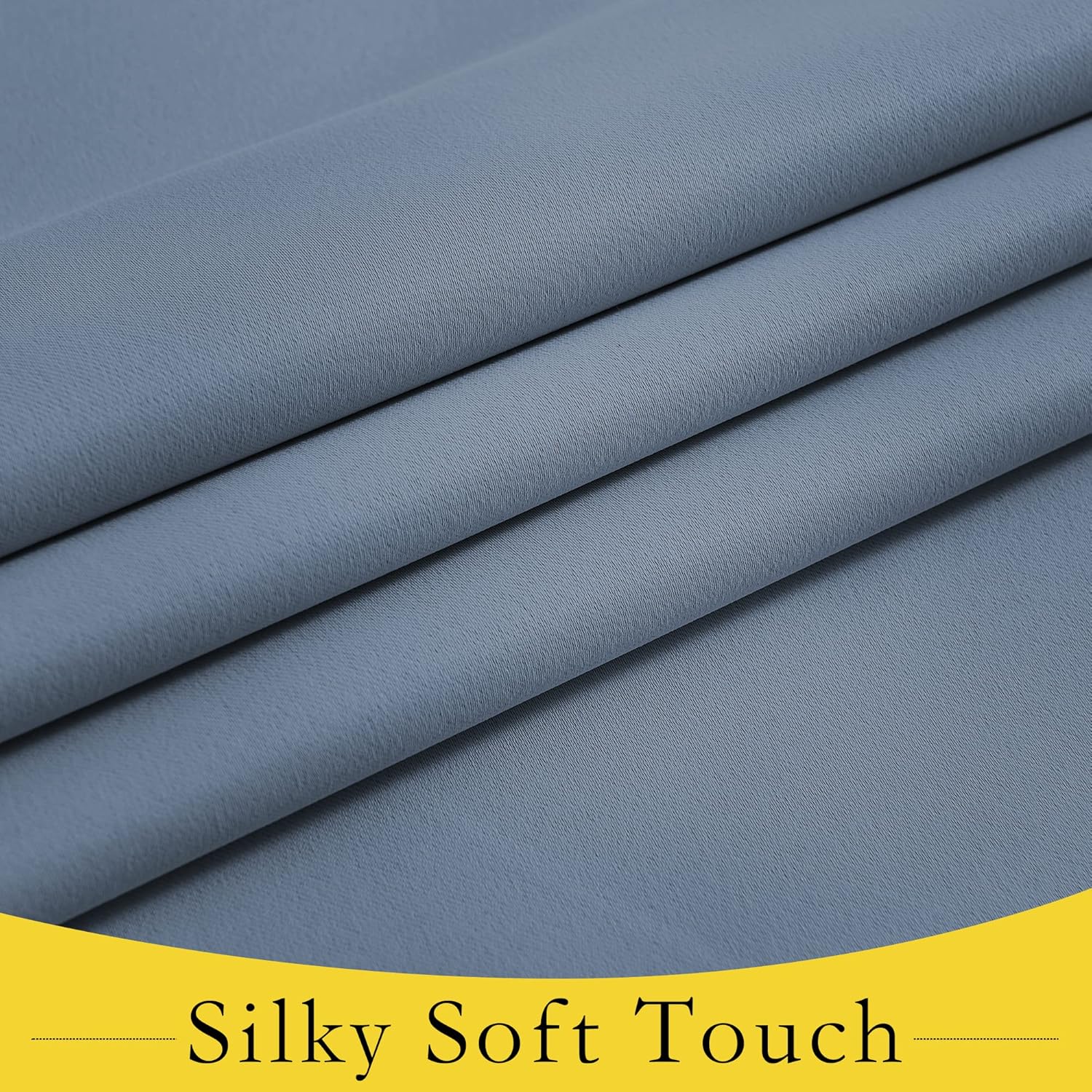 Close-up of slate blue fabric with a silky soft texture, showing subtle weave and graceful folds.
