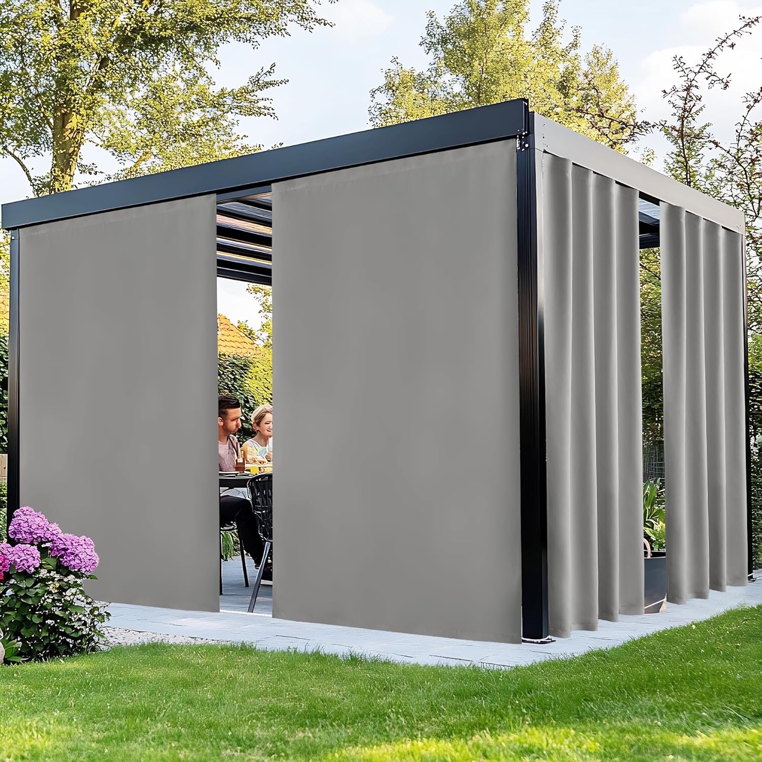 Grey retractable fabric privacy sidewalls on a black outdoor pergola.