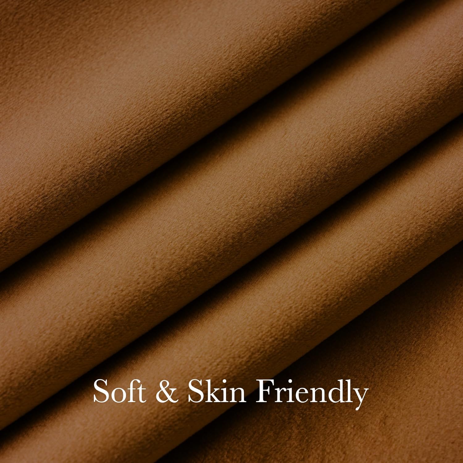 Close-up of soft, skin-friendly, camel-brown fabric with gentle folds and a smooth texture.