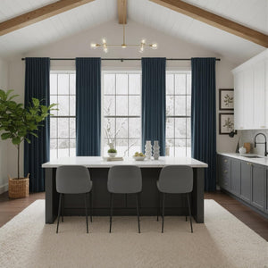 Soft cream shaggy area rug under a kitchen island with bar stools on dark wood flooring.