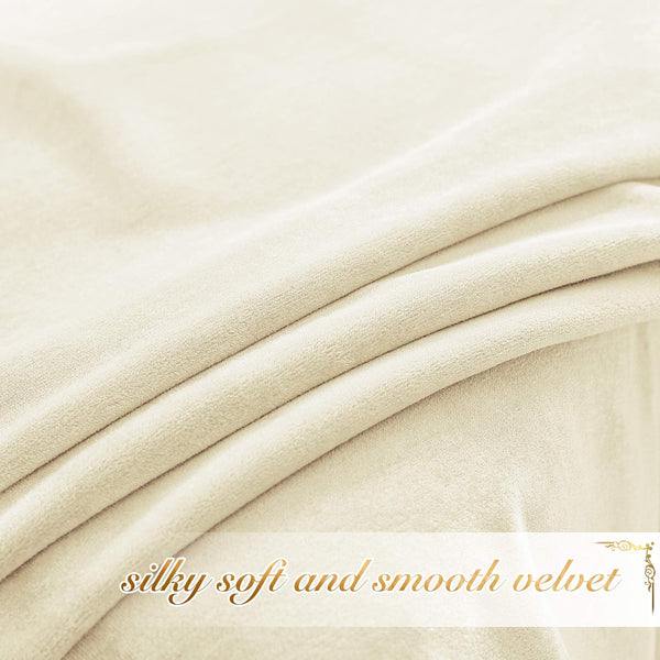 Close-up of a soft, cream-colored velvet fabric with gentle folds, highlighting its silky texture.