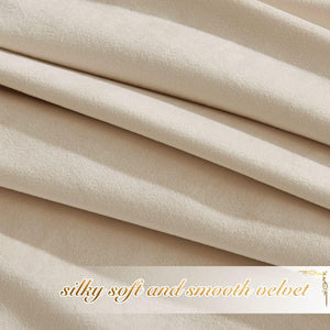 Close-up of soft, luxurious cream velvet fabric showing its smooth texture and elegant drapes