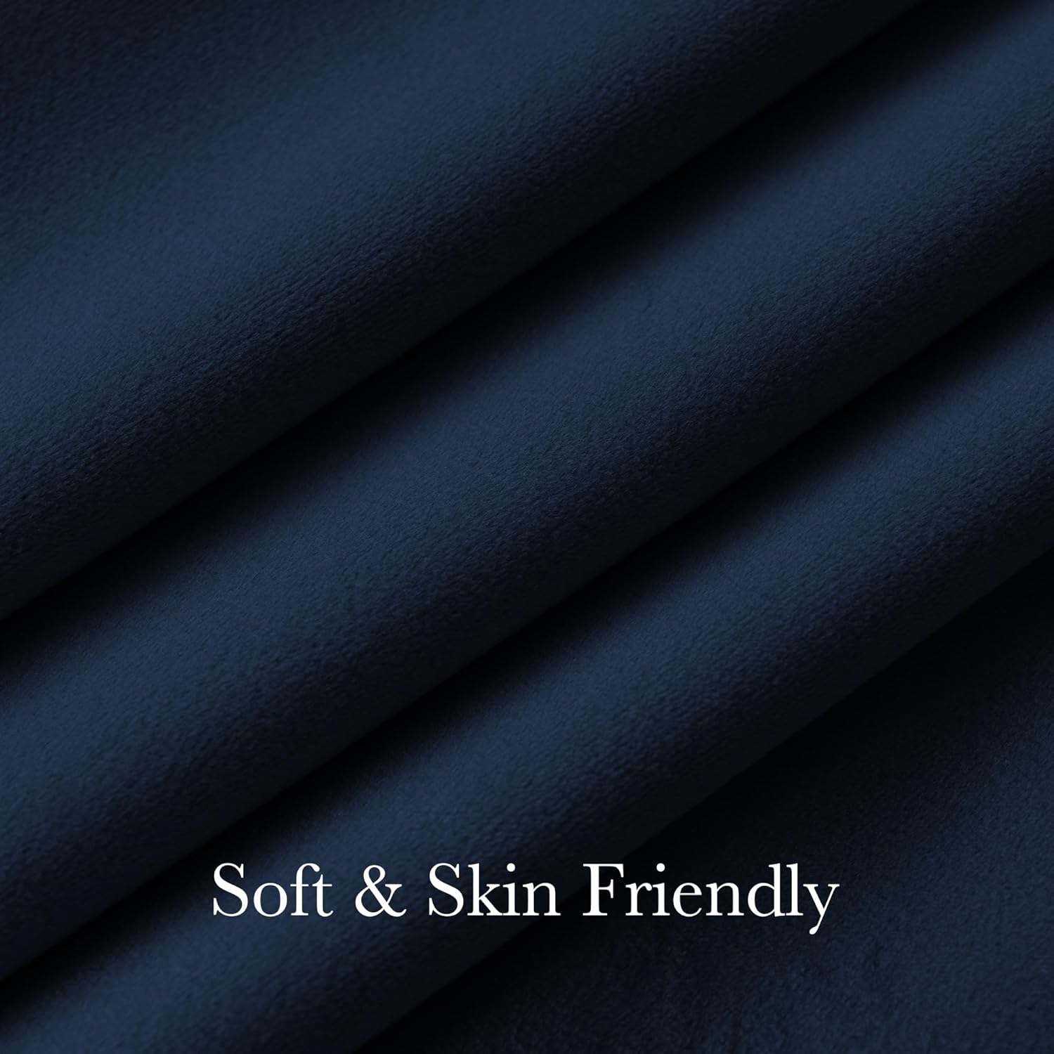 Close-up of soft and skin-friendly navy blue fabric with a plush texture and gentle folds.