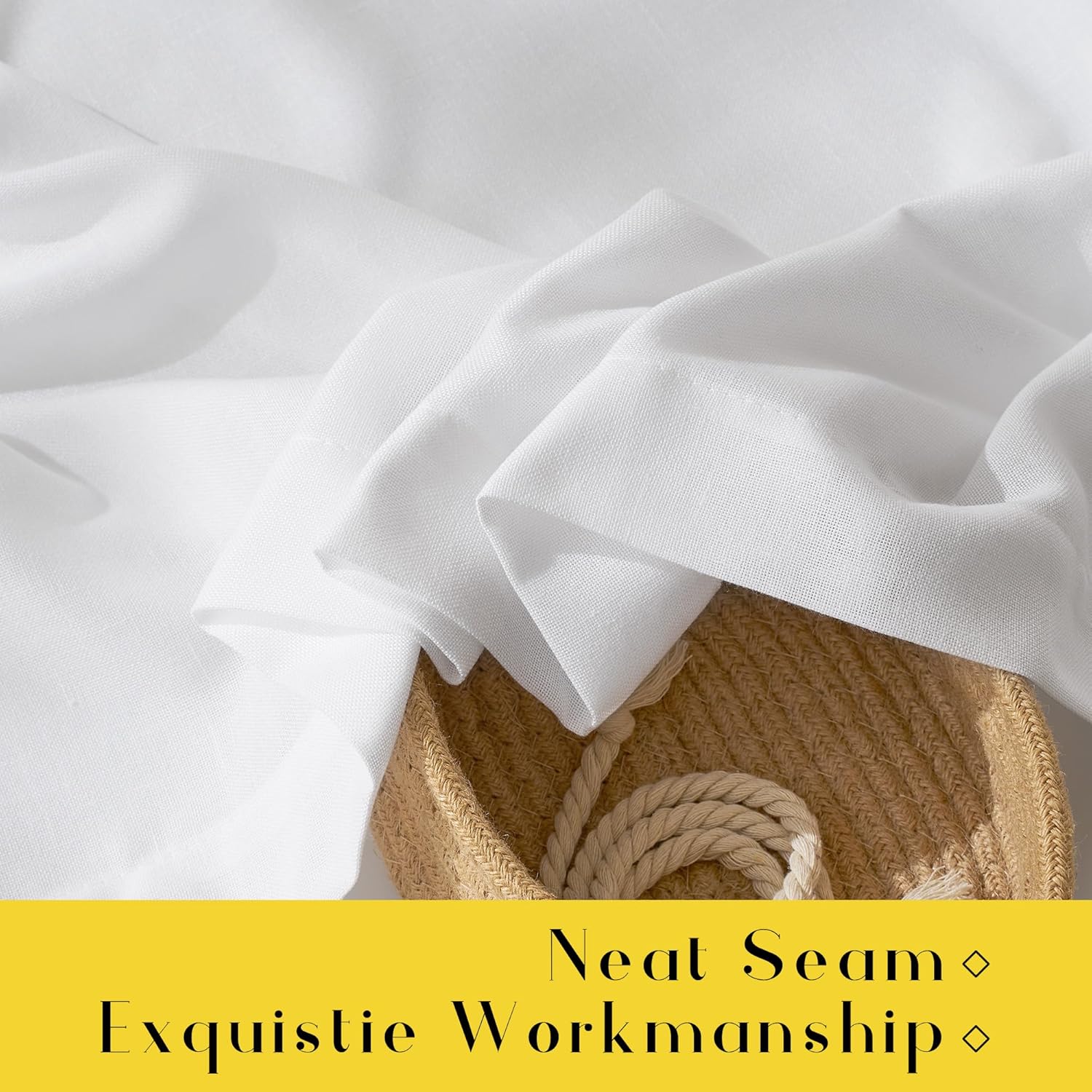 Soft white linen-blend fabric showing subtle texture and graceful folds. A woven basket is partially visible.