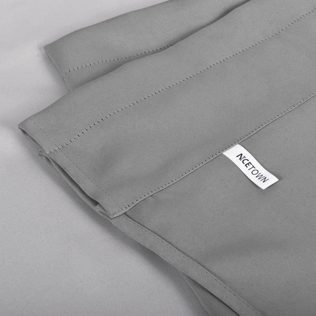 Close-up of a solid grey smooth fabric curtain panel showing the top hem and white NCETOWN brand tag.