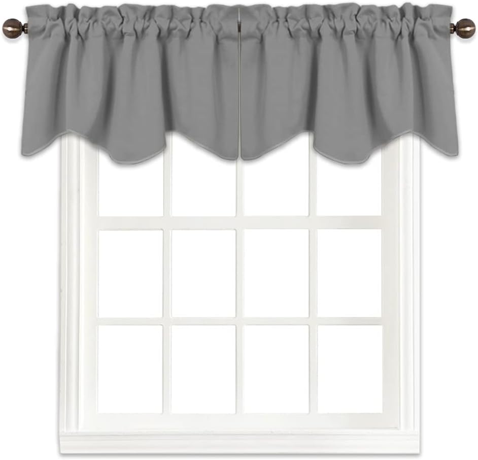 Grey valance with a decorative scalloped bottom edge and gathered rod pocket, displayed on a bronze rod.
