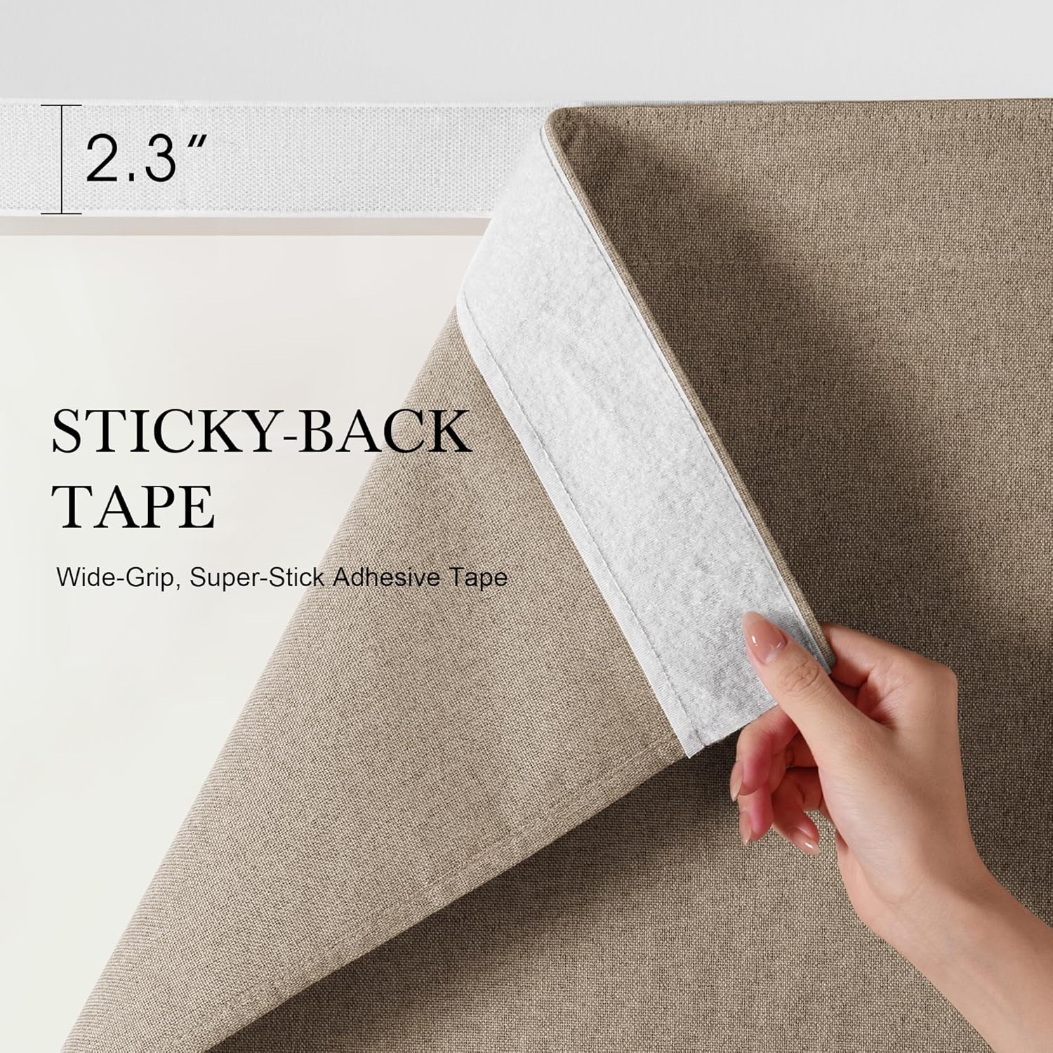Hand peeling beige woven fabric to reveal 2.3 inch wide white sticky-back adhesive tape underneath.