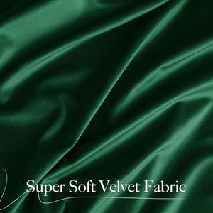 Detailed view of super soft emerald green velvet fabric with luxurious folds and a lustrous texture.