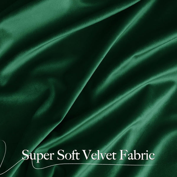 Detailed view of super soft emerald green velvet fabric with luxurious folds and a lustrous texture.