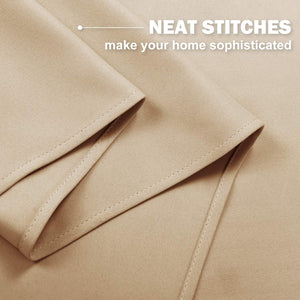 Close-up of a light tan fabric with neat, visible stitching along a folded hem, showcasing quality detail.