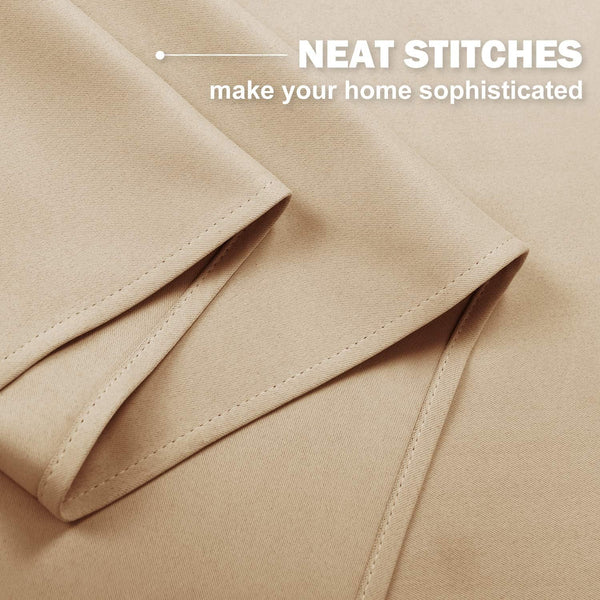 Close-up of a light tan fabric with neat, visible stitching along a folded hem, showcasing quality detail.