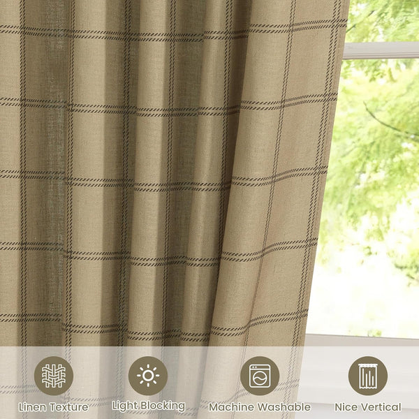 Tan linen textured curtain with dark brown plaid windowpane pattern hanging by a sunlit window.