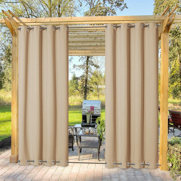 Tan outdoor privacy curtains with grommet tops hanging on a rod under a wooden pergola on a patio.