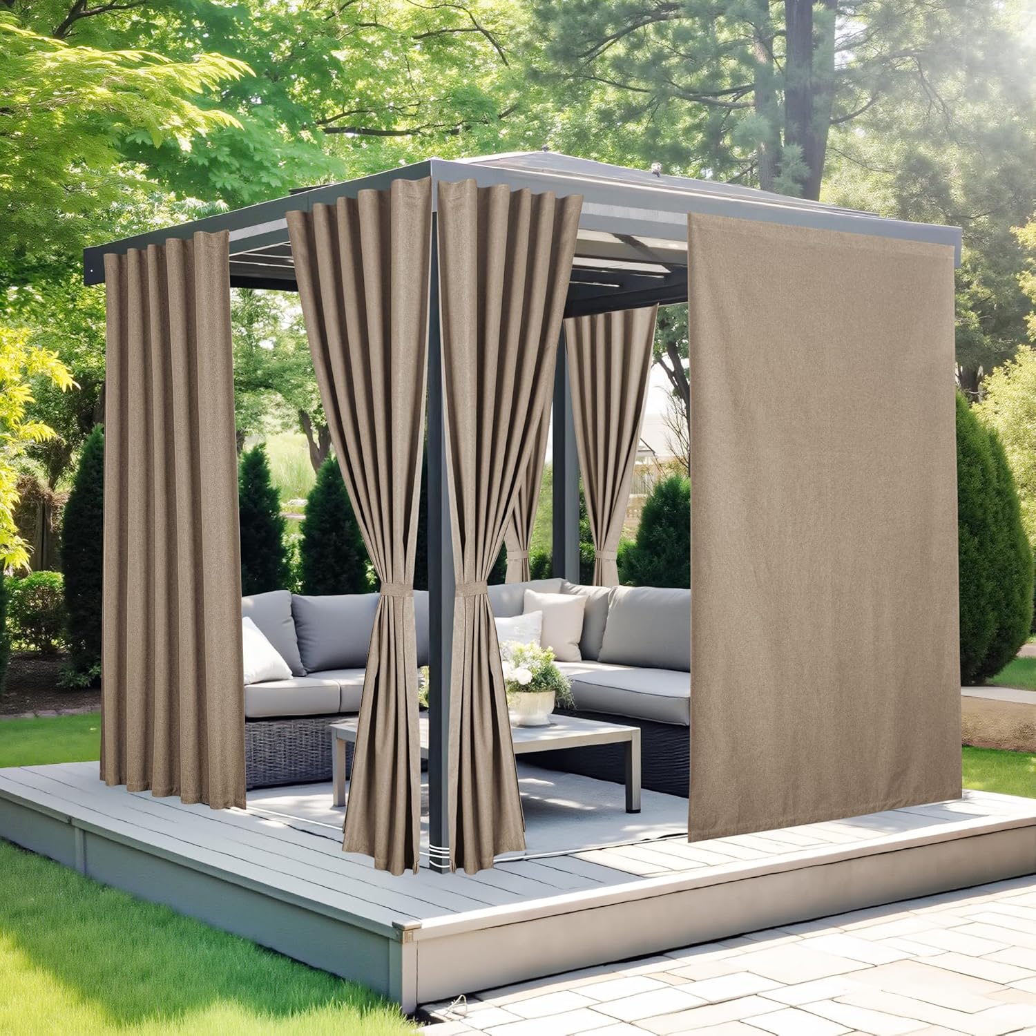 Tan outdoor grommet top curtains on a metal gazebo providing privacy for a deck seating area.