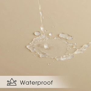 Water streams onto a beige textured fabric, beading up to show its waterproof and spill-resistant quality.