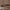 Close up of a taupe blackout curtain fabric showing a neatly stitched flat seam construction.