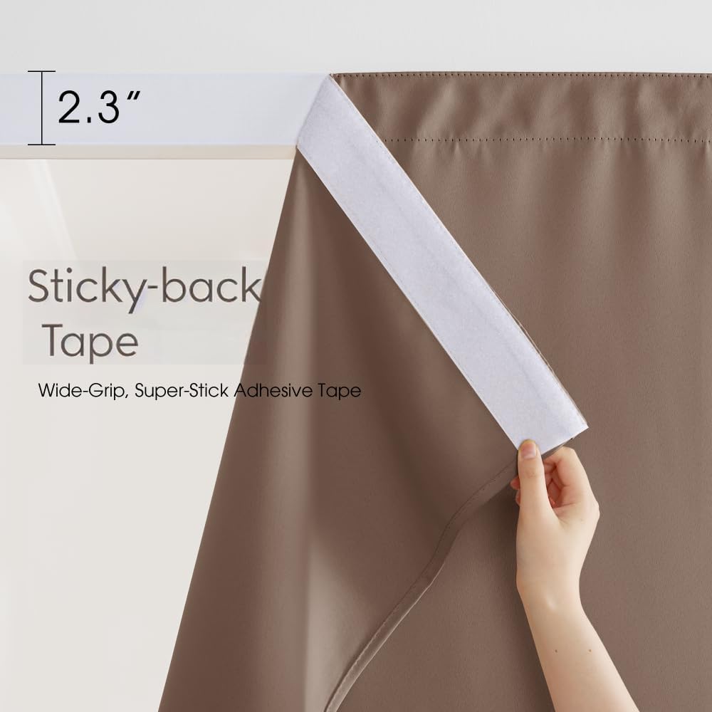 Hand reveals wide white sticky-back adhesive tape on taupe blackout curtain top edge.