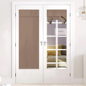 Taupe fabric tie-up shades on white french doors. One fully extended, the other tied up decoratively.