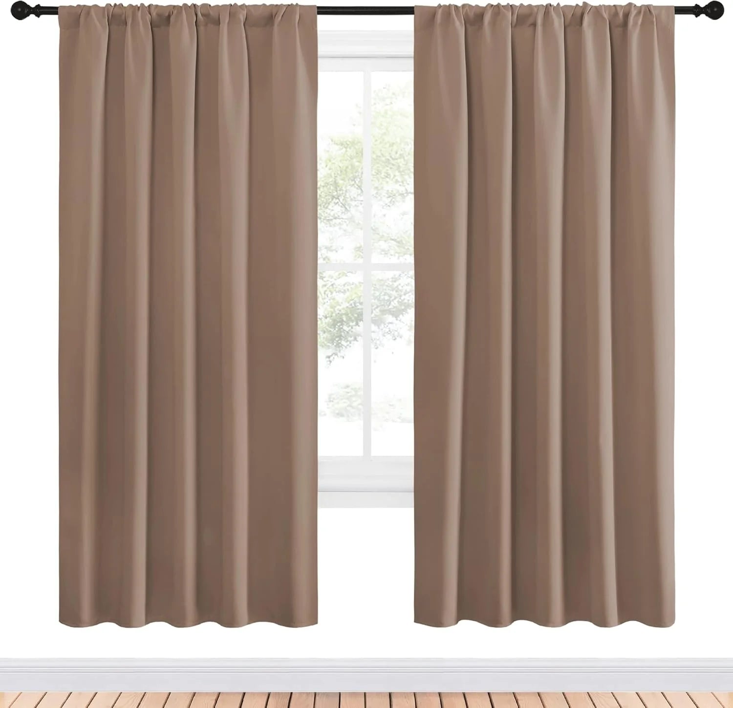 Taupe blackout curtains with rod pocket top hanging on a black curtain rod