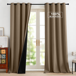 A pair of taupe brown blackout curtains with grommet tops hangs over a french door. The left panel reveals the black thermal lining.