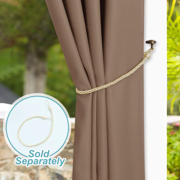 Taupe brown window curtain gathered with a decorative braided gold rope tieback and bronze wall hook.